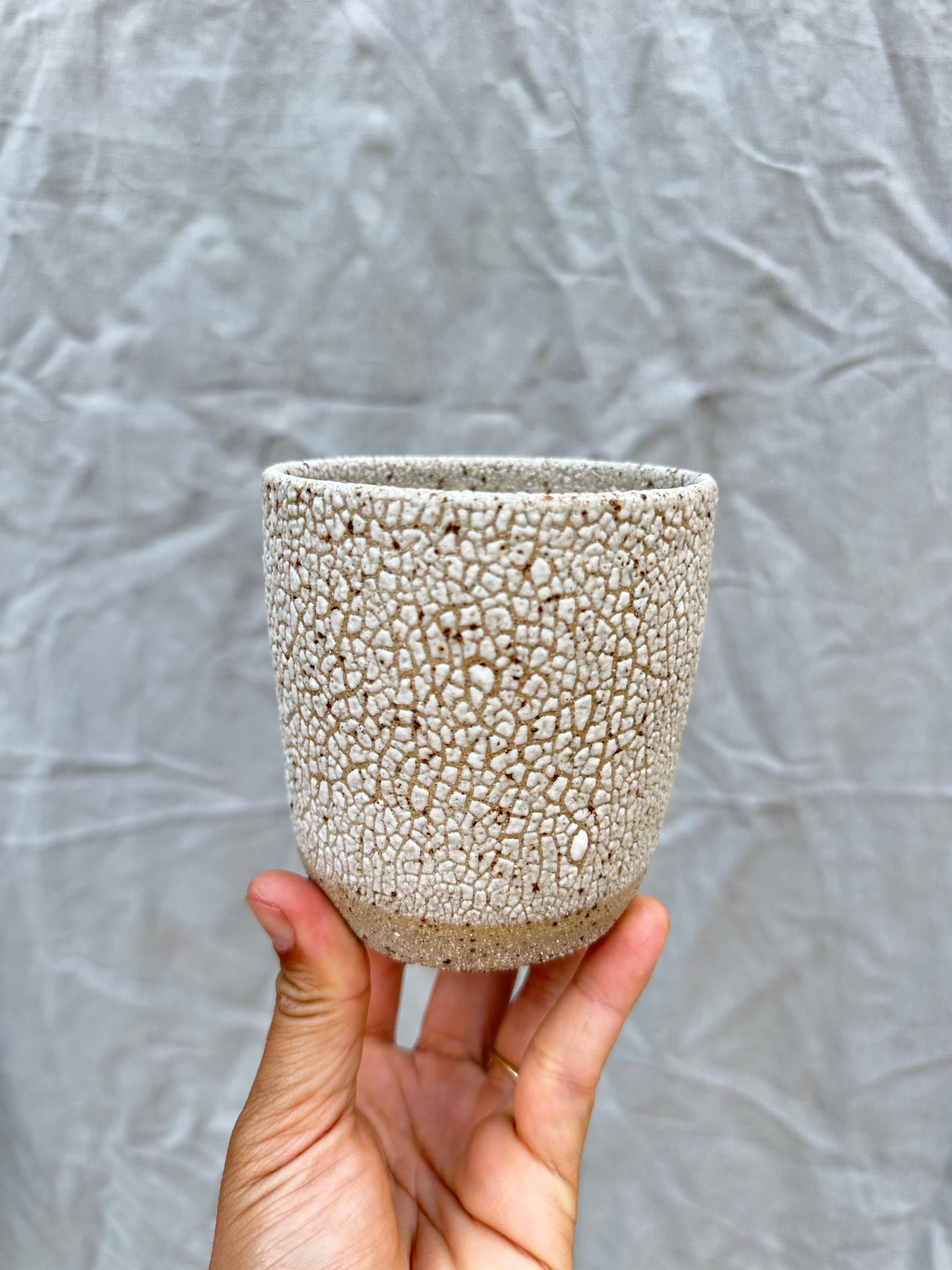 handmade planter against a grey background